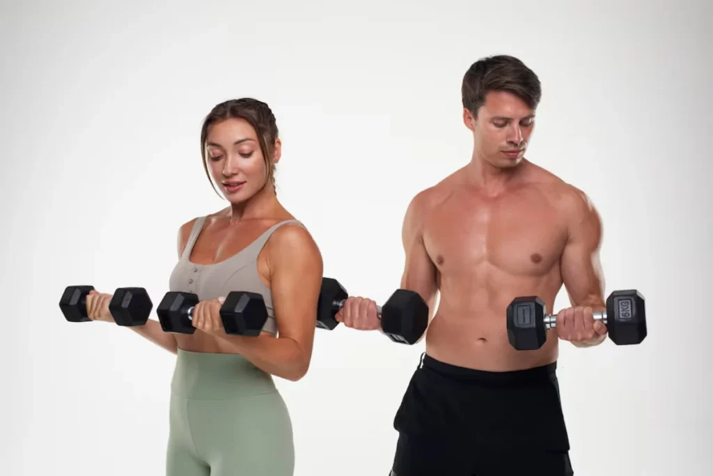 Man and woman exercising with dumbbells on a white background.